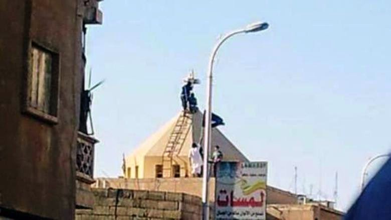Cross being removed from the Armenian Church in Raqqa, Syria